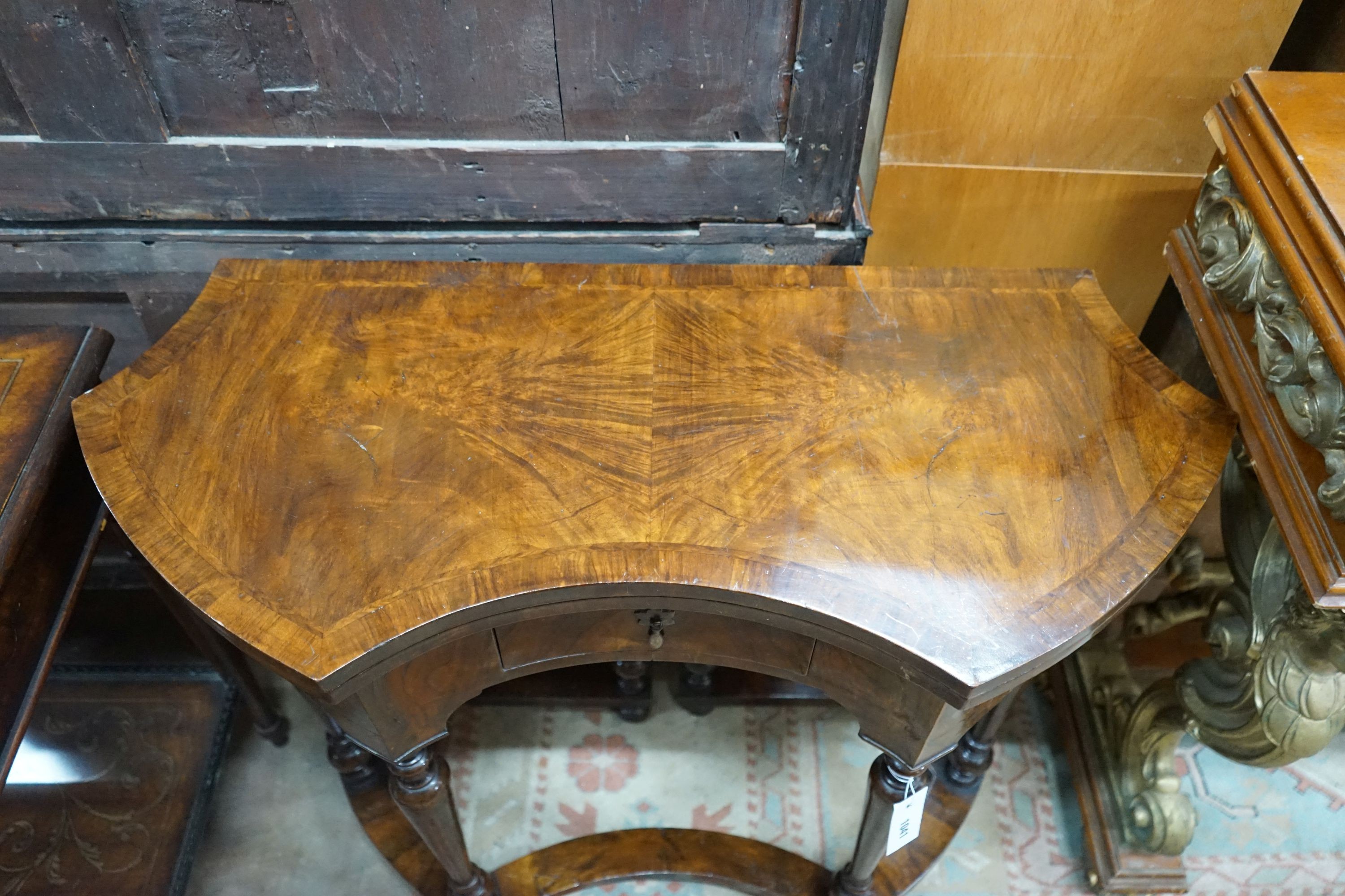 A Queen Anne Revival walnut folding card table, width 84cm, depth 37cm, height 74cm